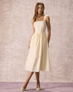 The Light Yellow Pleated Cross Back Midi Dress 9 The Light Yellow Pleated Cross Back Midi Dress -CINN Clothing Shop the square neck solid midi dress dresses 75iow3