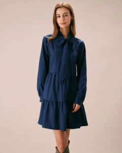 The Blue Tie-Neck Tiered Babydoll Mini Dress 8 The Blue Tie-Neck Tiered Babydoll Mini Dress -CINN Clothing Shop the tie neck collar babydoll dress blue dresses 7dr7zd