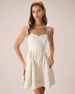 The Off White Jacquard Tie Strap Mini Dress 11 The Off White Jacquard Tie Strap Mini Dress -CINN Clothing Shop the tie strap jacquard mini dress dresses dctdsf