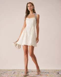 The Off White Jacquard Tie Strap Mini Dress 10 The Off White Jacquard Tie Strap Mini Dress -CINN Clothing Shop the tie strap jacquard mini dress dresses jlsv7m